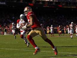 Michael Crabtree corre in end zone, domenica è stata la sua giornata